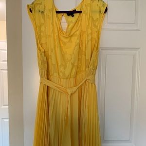 Yellow dress with pleated skirt